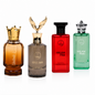 Four men's cologne bottles from Hikam and Zahir perfume displayed side-by-side on a white background. The bottles include Zahir (amber liquid with a gold crown cap), Izzul Arab (gray-brown liquid with a gold eagle cap), Hikam Flint (red liquid with a black cap), and Hikam Haze (green liquid with a silver cap).